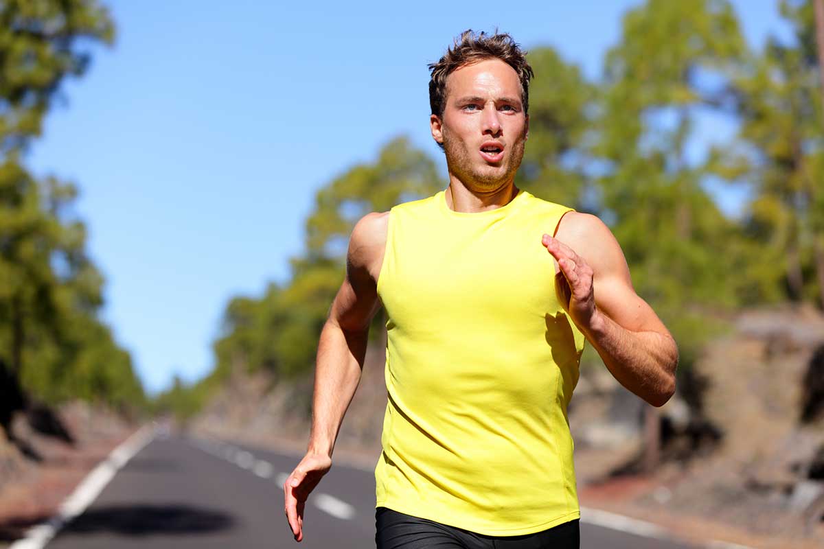 Male athlete runner training at fast speed